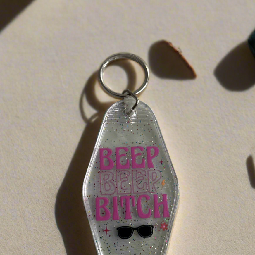 Clear glitter retro style motel key chain that says Beep Beep Bit**