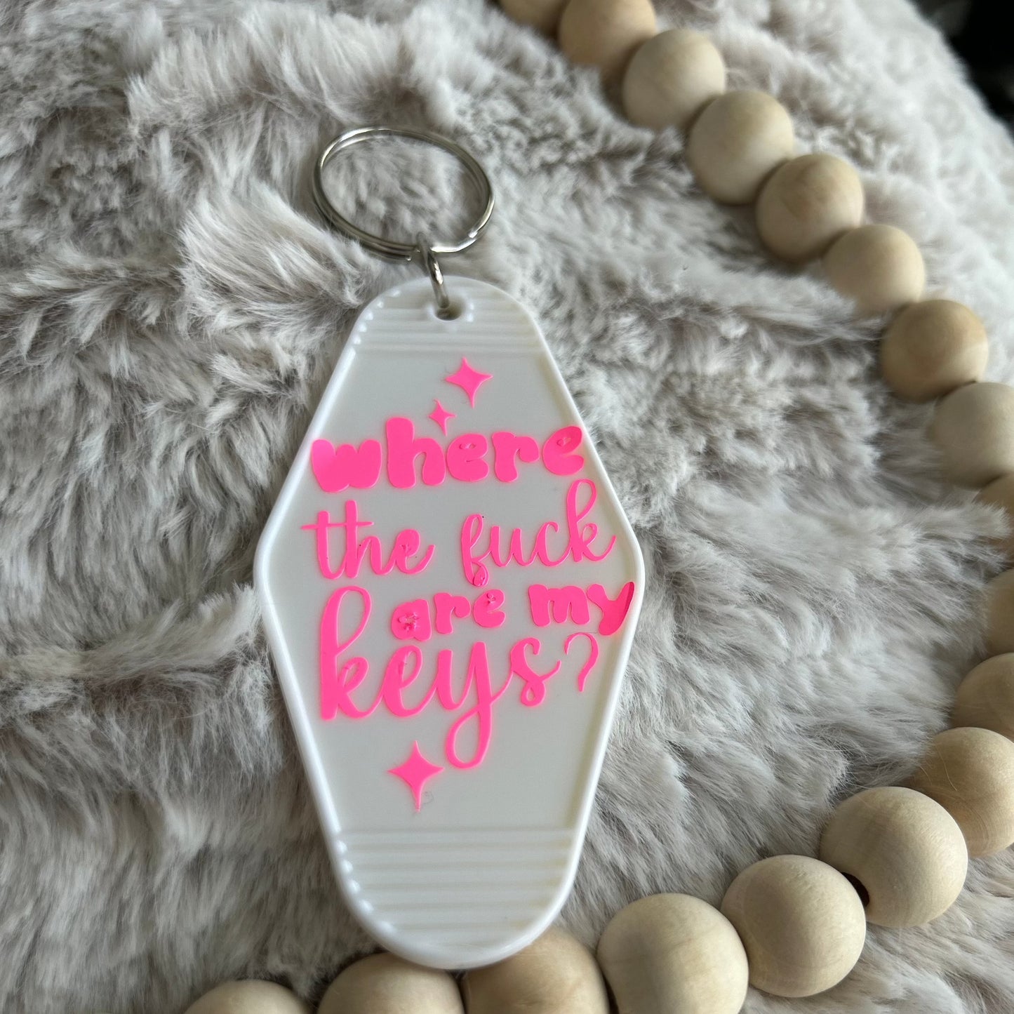 White retro motel keychain with pink lettering that says where the F*** are my keys
