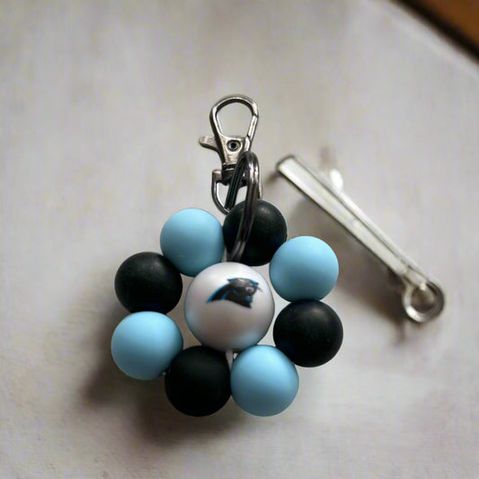 Blue and Black sport flower keychain made with food safe silicone beads