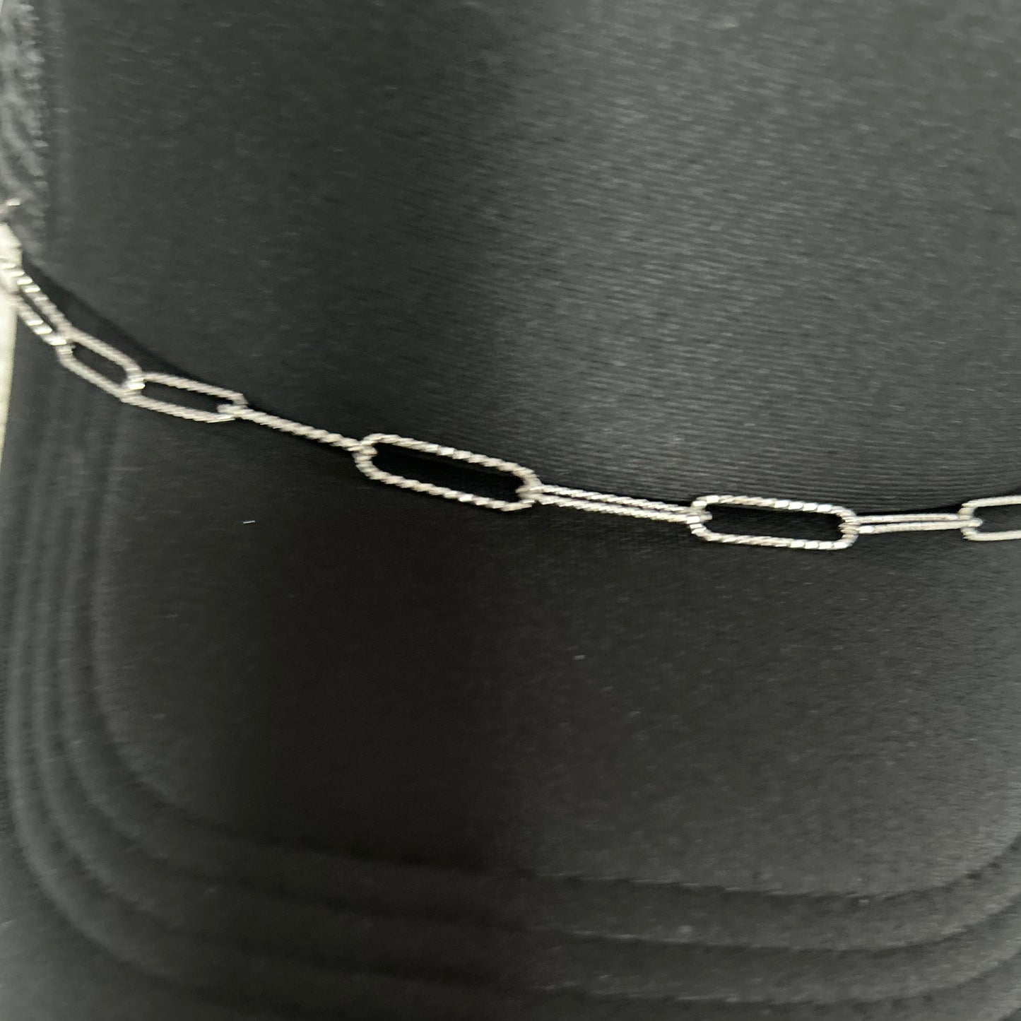 Embossed Elegance: Paperclip Trucker Hat Chain