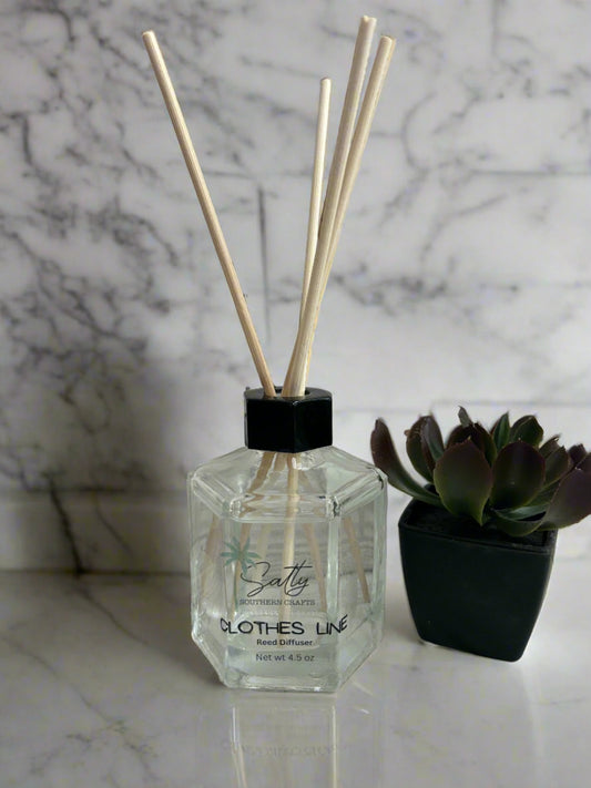 Reed diffuser with reeds in the scent clothesline