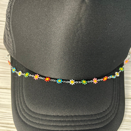Multi colored daisy trucker hat chain on a black hat