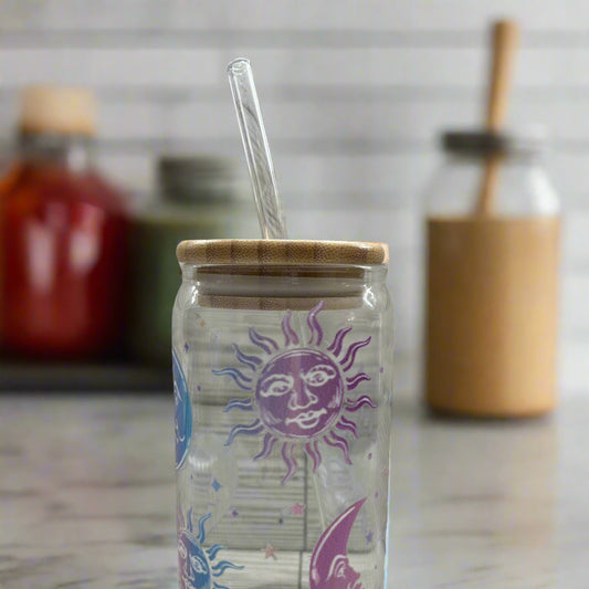 Glass tumbler with a sun and moon design 16 oz