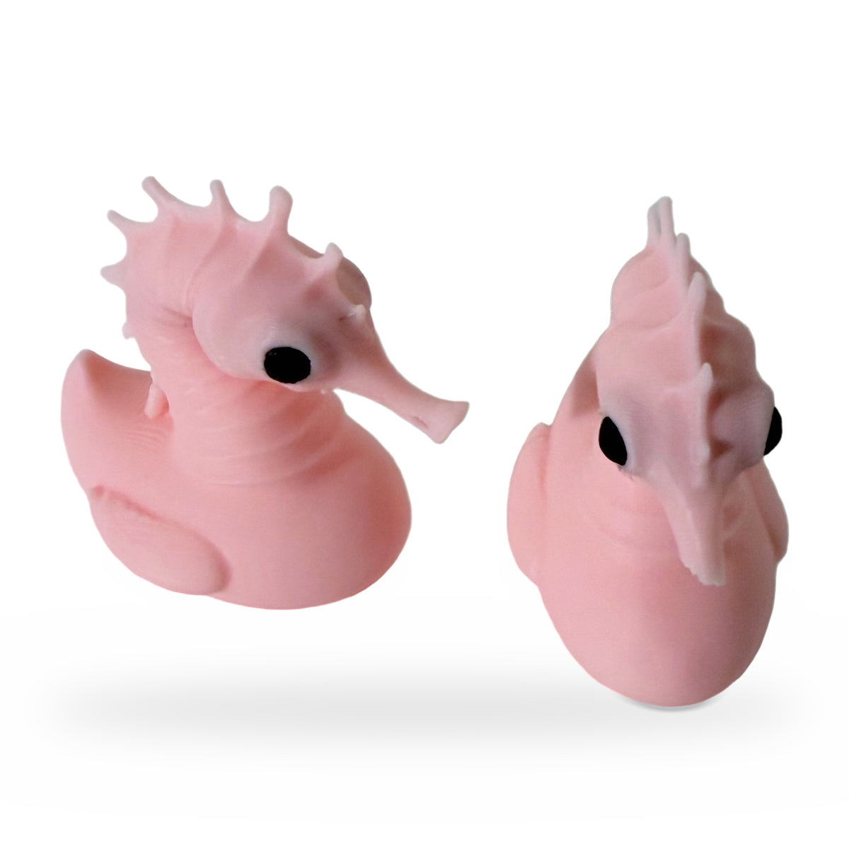 Two pink 3D printed seahorse ducks