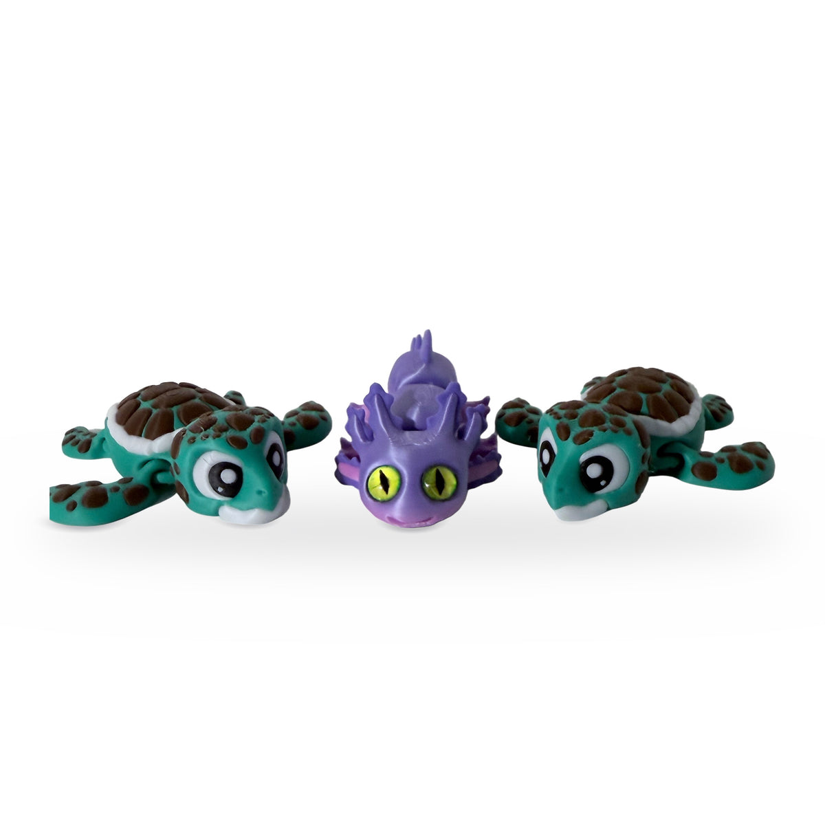 Axolotl and two sea turtle flexi toys