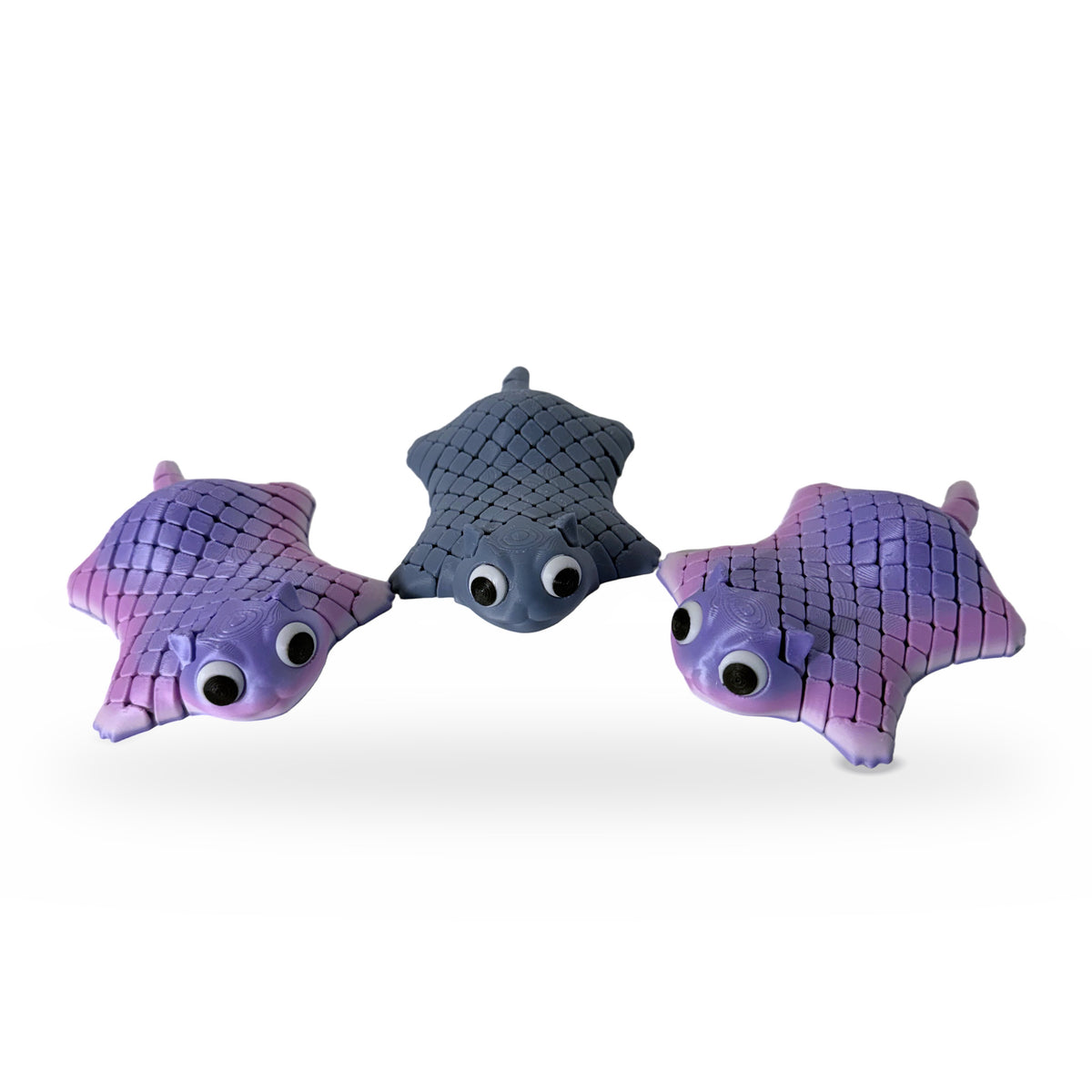 Stingray fidget toys in pink, purple and gray