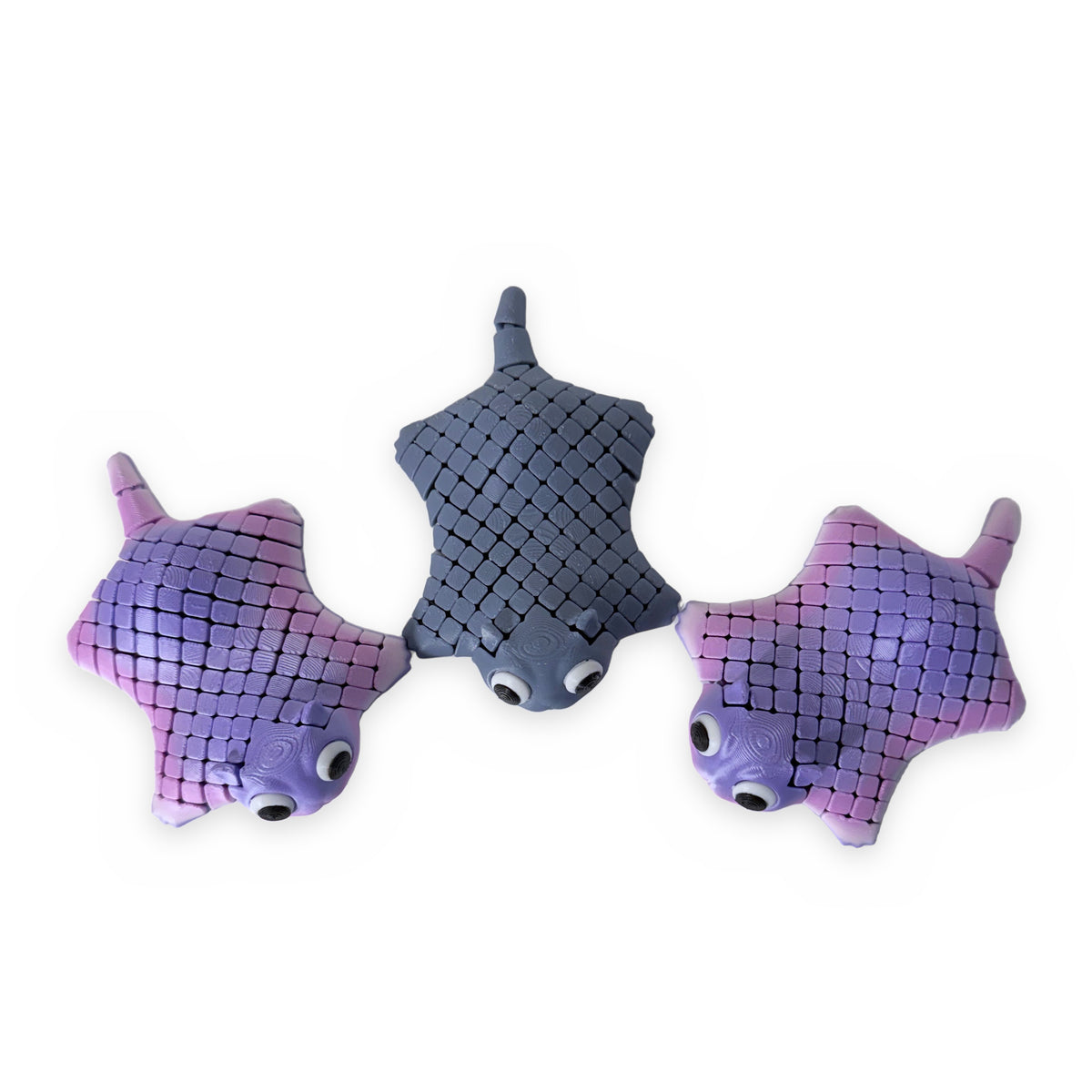 Three 3D printed stingray fidget toys
